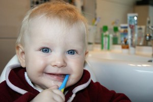Toddler child brushing his teeth