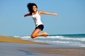 Woman jumping on a beach